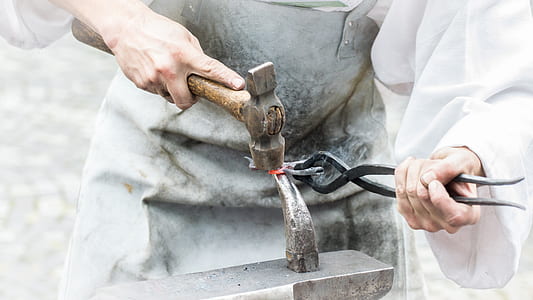 person holding brown hammer thumbnail