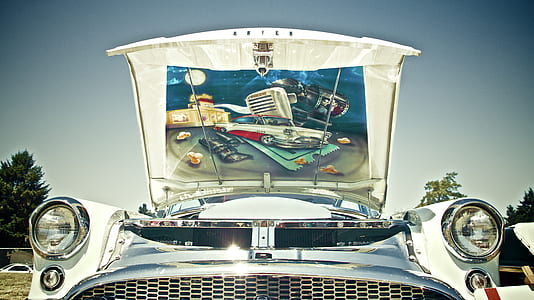 classic white car with open hood thumbnail