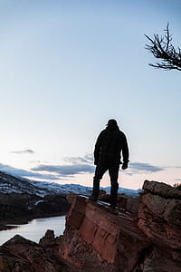 person standing on the edge of cliff thumbnail