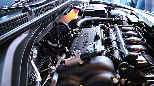 gray and black vehicle engine in close-up photo thumbnail