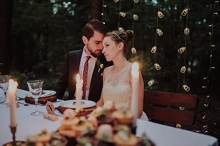 couple sitting on chair beside dining table thumbnail