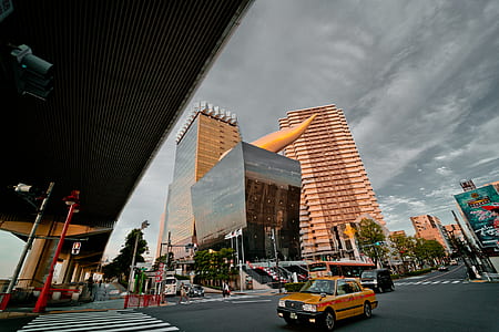 yellow taxi car in the middle of street thumbnail