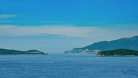 Blue Sea Near Mountains thumbnail