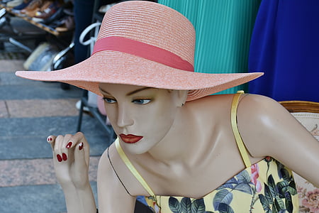 mannequin wearing pink hat thumbnail