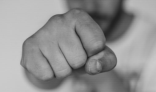 close up photograph of person hand fist thumbnail