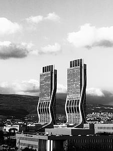 Greyscale Photography of Two High Rise Buildings thumbnail