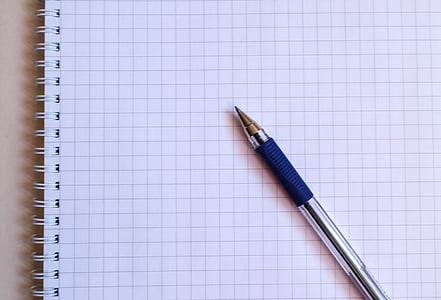 blue ball-point pen and white spiral book thumbnail