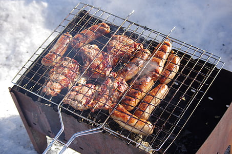 sausage grilled on gray steel grill thumbnail