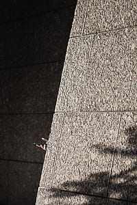 person holding smartphone hiding on wall thumbnail