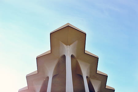 white and gray concrete building under blue sky thumbnail