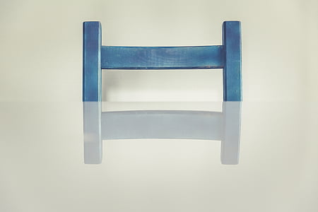 blue chair in front of table thumbnail