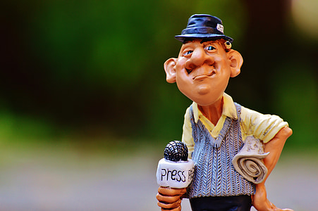 shallow focus photography of man figurine thumbnail