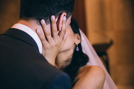 Bride and groom kissing each other at wedding thumbnail
