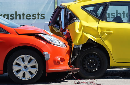red car crushed on yellow car thumbnail