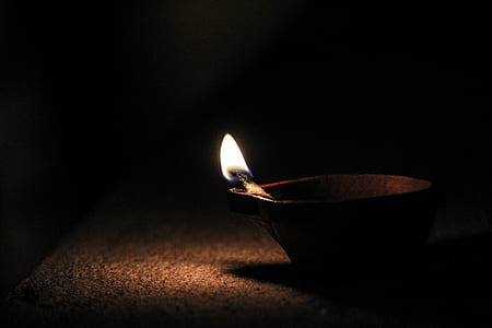 brown candle on brown holder thumbnail