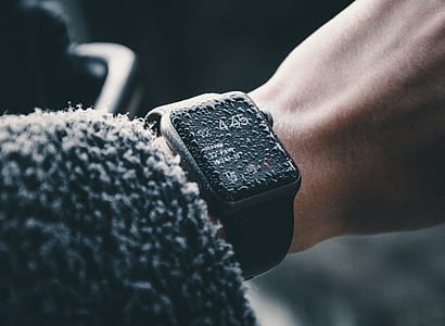 person wearing black Apple Watch with water droplets thumbnail