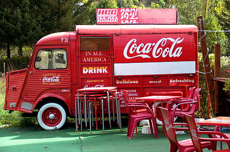 red Coca-Cola van near table thumbnail