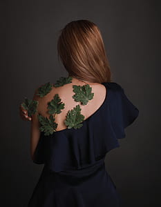 woman with green leaves on her back thumbnail