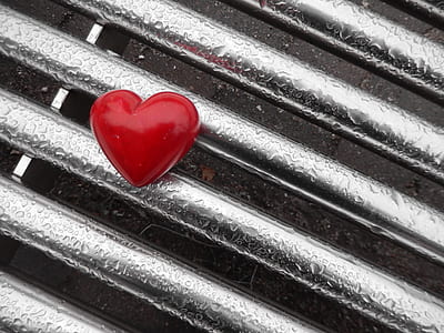 red heart on gray metal board thumbnail