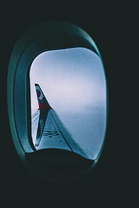 view through airplane window of sky during daytime thumbnail