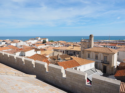 brown house roof under horizon thumbnail