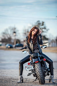 woman sitting on black motorcycle thumbnail