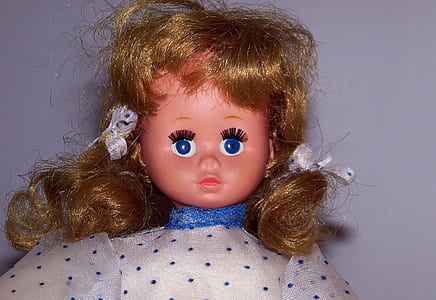 doll wearing white and blue polka-dot top thumbnail