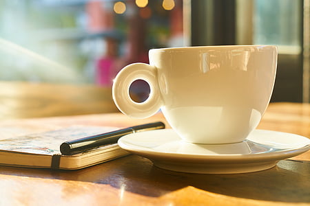 white ceramic coffee mug on table thumbnail