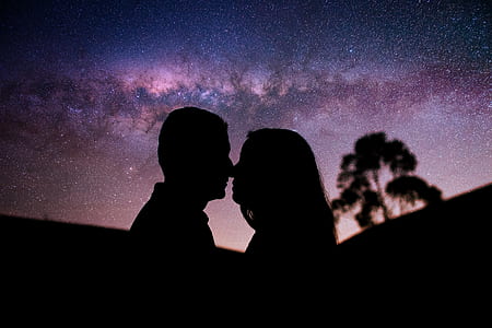 silhouette photography of a man and woman facing thumbnail