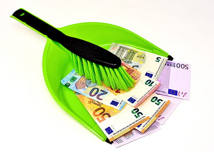 black handled green brush on assorted-amount Euro banknotes thumbnail