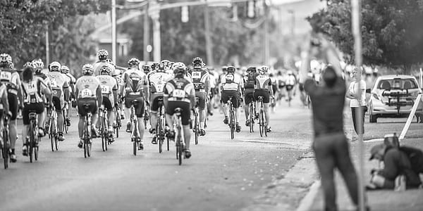 grayscale photo of people cycling thumbnail