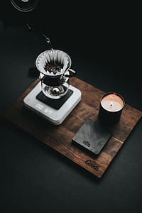 black candle holder on brown wooden board thumbnail