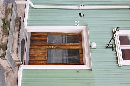 closed glass door with brown wooden frame during daytime thumbnail