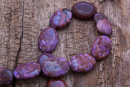 purple pebbles on brown surface thumbnail