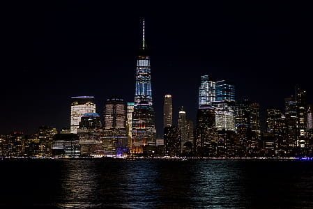 Skyline Beside the Body of Water at Night Time thumbnail