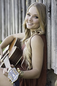 blonde hair woman holding guitar thumbnail