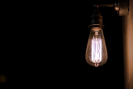 clear light bulb on wall thumbnail