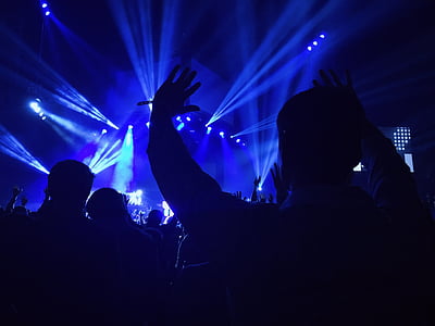 silhouette of people near blue stage lights thumbnail