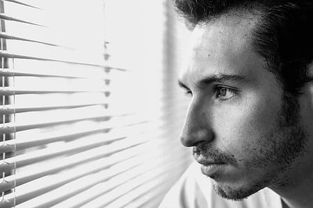 Man Looking Through Window thumbnail