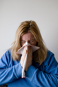 woman holding handkerchief on her nose thumbnail
