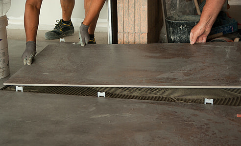 person holding brown wooden board thumbnail