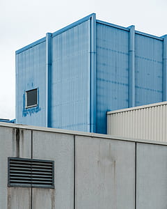 blue and white concrete building during daytime thumbnail