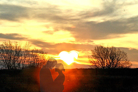 double exposure photo of man and woman facing each other during golden hour thumbnail