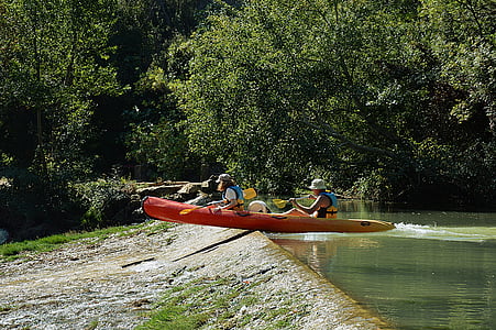 two men riding on kayak during daytime thumbnail