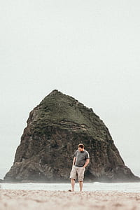 man standing on shore thumbnail