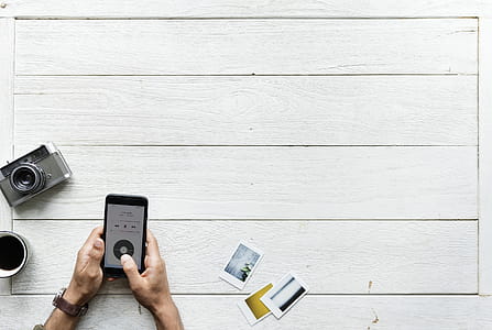 Flat Lay Photography of Person Holding Android Smartphone thumbnail
