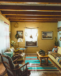 brown wooden rocking chair inside living room thumbnail