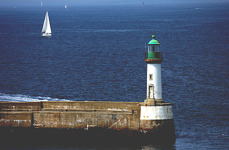landscape photography of lighthouse during daytime thumbnail