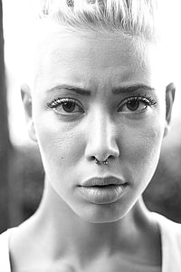 woman taking picture with serious face thumbnail