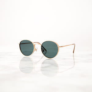 gold-colored framed gray lens sunglasses on white background thumbnail